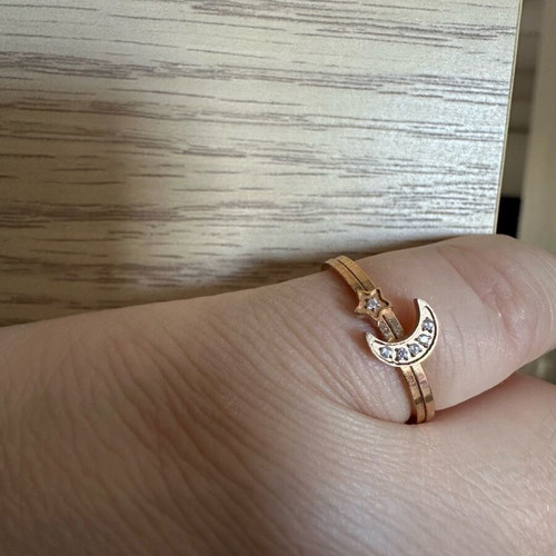 Steel rings like new, star and moon design, gold color, set of 2
