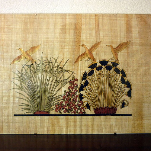 Egyptian papyrus with painting in glass frame