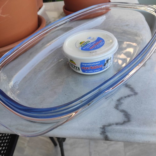 Glass Pyrex and cast iron pot used with surface wear