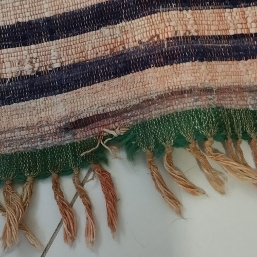 Kilim runner rug used with wear at fringes