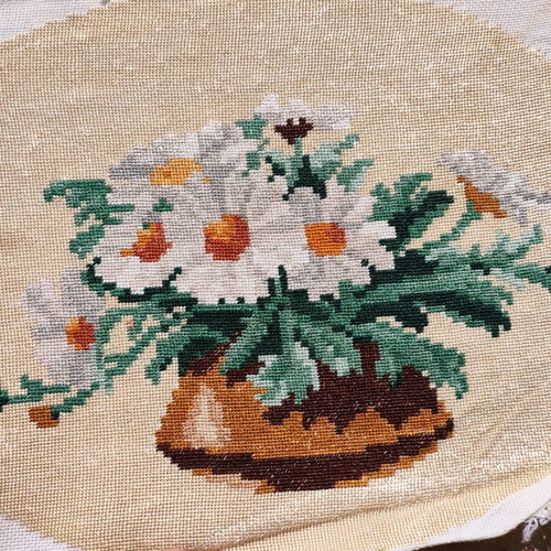 Vintage needlepoint with embroidered daisy bouquet used