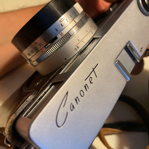 Canon Canonet vintage camera with 45mm f/1.9 lens and leather case like new