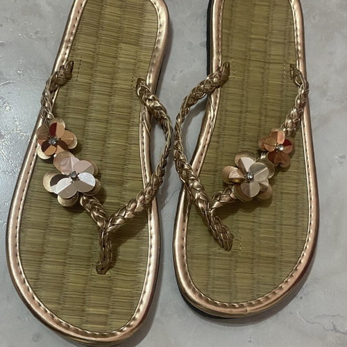 Women's flip flops with floral design, like new, gold bronze