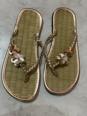 Women's flip flops with floral design, like new, gold bronze