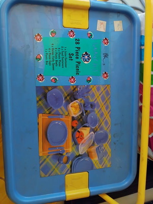 Picnic set like new with 8 knives, forks, spoons, plates, glasses, bowls, and containers
