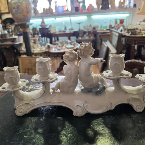 Hutschenreuther Selb porcelain four-light candelabra used, putti design