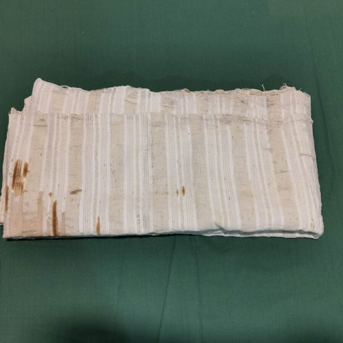 Woven bed sheet used with time stain from 1920 era