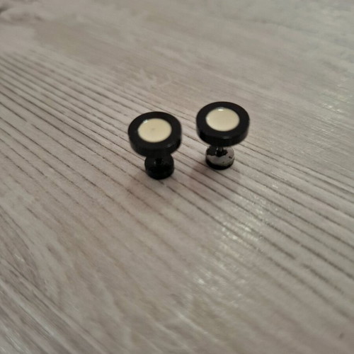 Barbell piercing earrings used, black and white, bar style