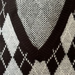 Showing sleeveless ski pullover checkered size small