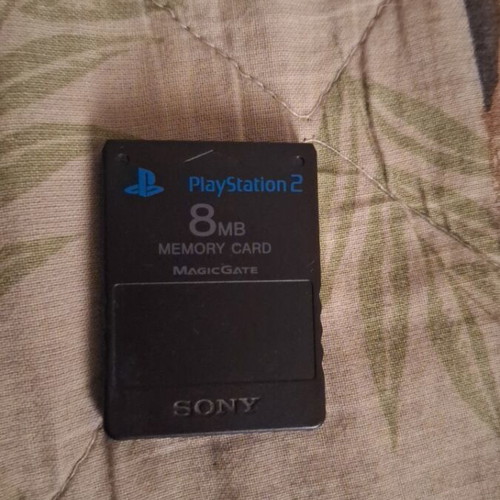 Sony PlayStation 2 console with 2 controllers, memory card and 5 games