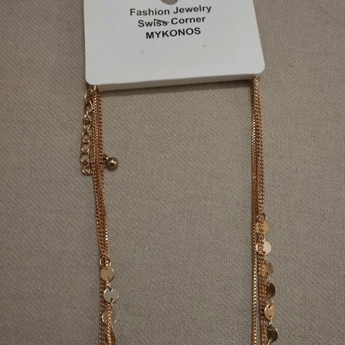 Triple necklace new with red stones and gold flower pendant