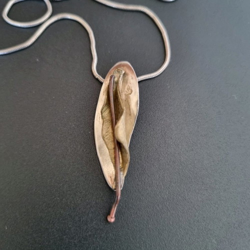 Silver handmade jewelry used with mixed materials leaf design
