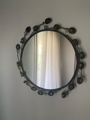Antique round mirror with brass designs like new