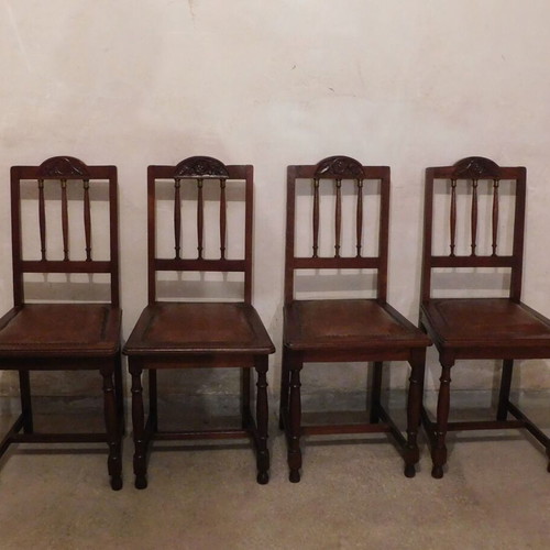 Wood-carved chairs with leather seat like new, set of 4