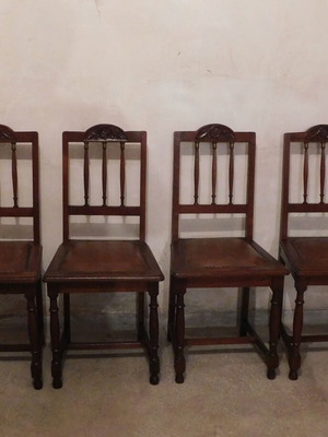 Wood-carved chairs with leather seat like new, set of 4
