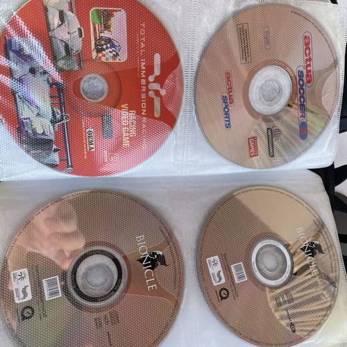 Vintage PC and PlayStation 2 gaming bundle with case, 70 CDs/DVDs