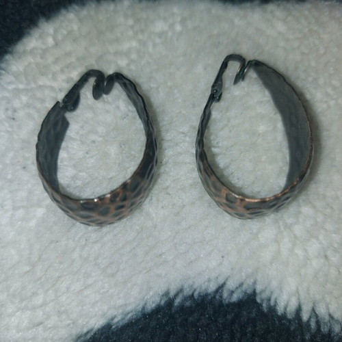 Clip-on earrings used, bronze color
