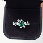 14K White Gold Engagement Ring with Emerald and Moissanite