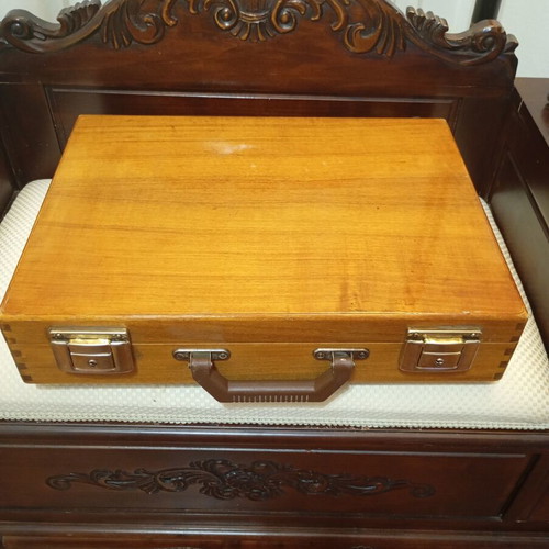 Vintage wooden suitcase made of genuine teak wood, used