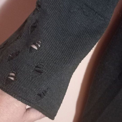 Long knitted gray dress used with loose neckline and decorative holes