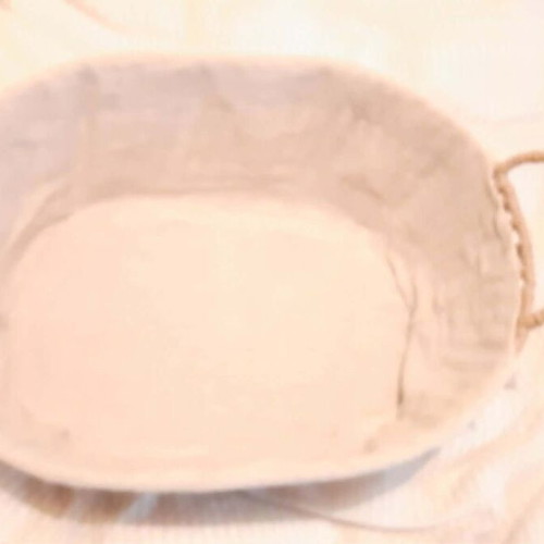 Oval basket like new with fabric lining and handles