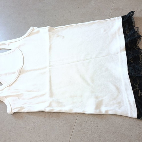White top with black lace hem, X-back cut
