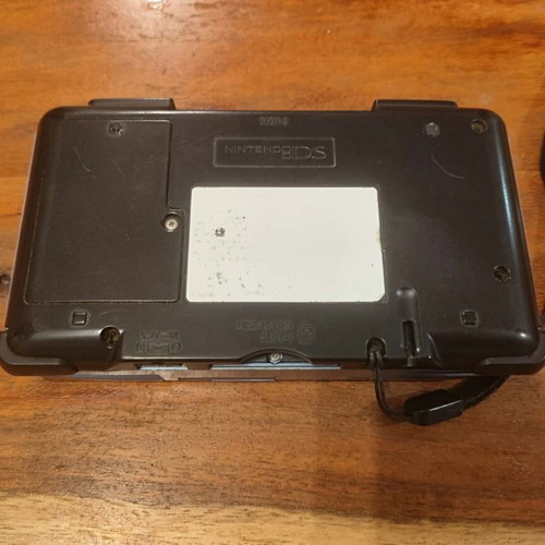 Nintendo DS console with charger and stylus