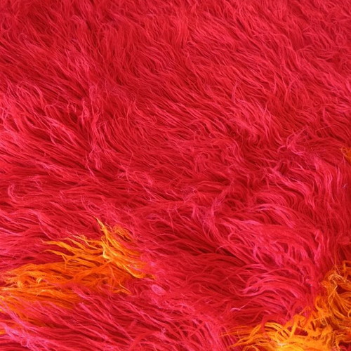 Long pile bed cover blanket, red with orange details