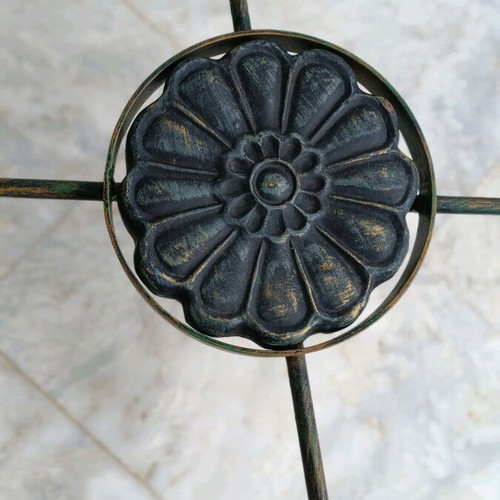 Metal table used with ceramic decoration and antique finish