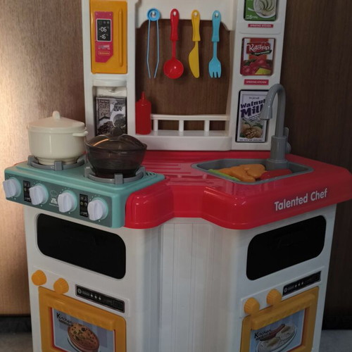 Play Kitchen used, plastic with light, music, and steam