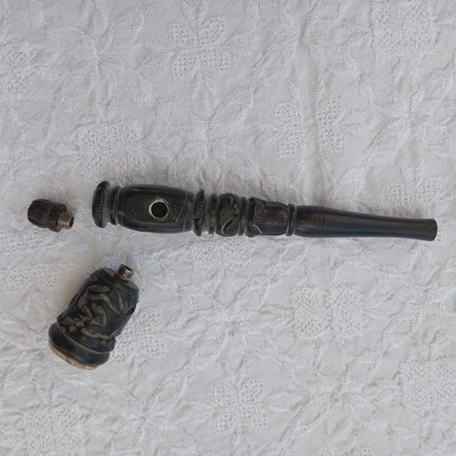 Handmade carved wooden pipe with stone inlay