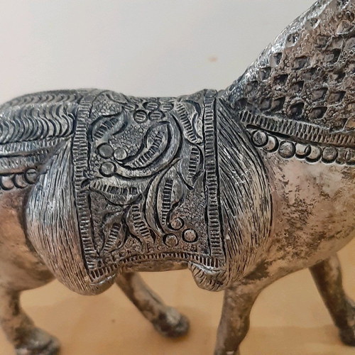 Vintage metal horse used with carved details