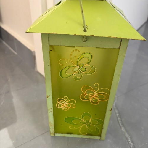 Green candle lantern used with rust spots