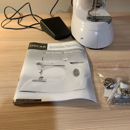 Sewing machine with battery like new with box and unused accessories