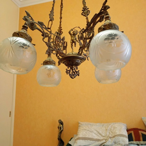 Solid brass chandelier used with crystals and putto figurine