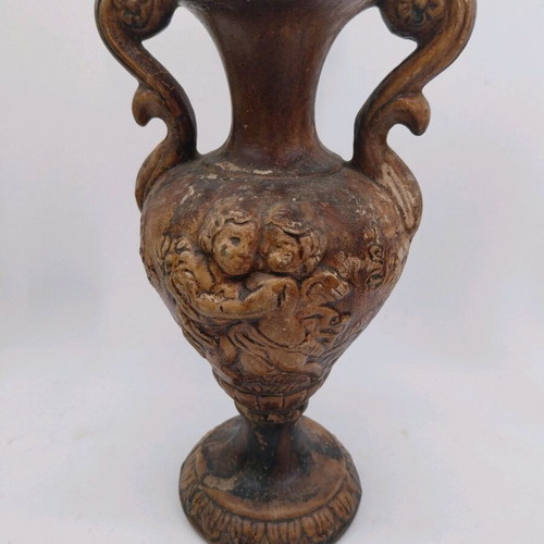 Ceramic amphora vase used, relief with cherubs