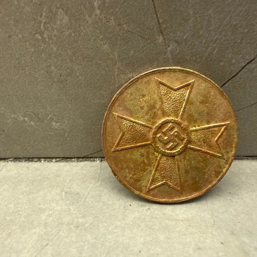 German metal WWII medal with cross and symbol