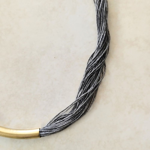 Minimal handmade necklace used, silk thread with metal element
