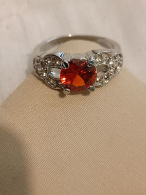 Vintage ring used with red stone and small crystals