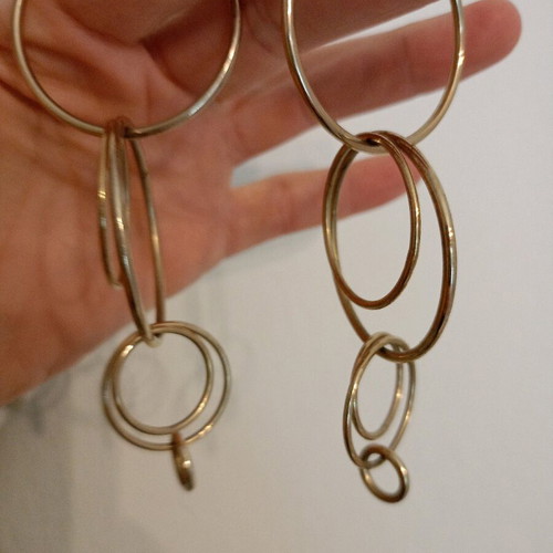 Earrings hoops braided together like new