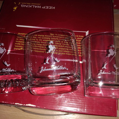 Johnnie Walker collectible set new with chess, whiskey glasses, and metal box