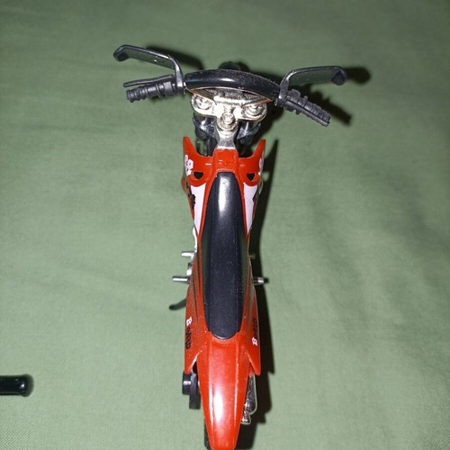 Motocross toy miniature new with extra wheels and nuts