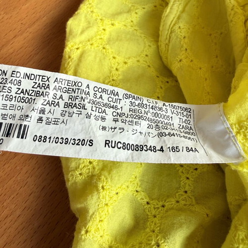 Zara yellow top used with ruffles and asymmetric neckline