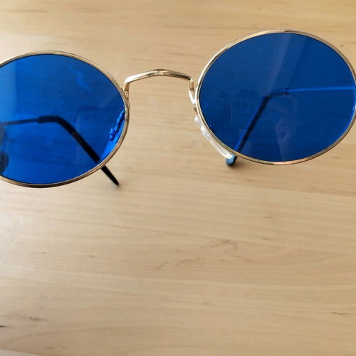 Oval sunglasses new with blue lenses and golden frames