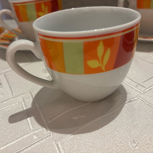 Vintage set of 6 cups and 6 saucers with bright colors, unused