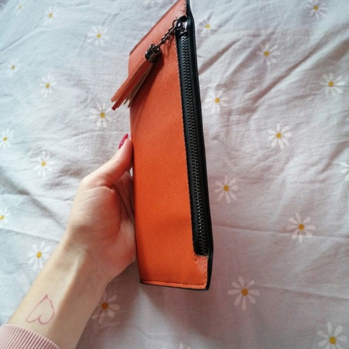 Orange wallet with six card slots and two bill compartments
