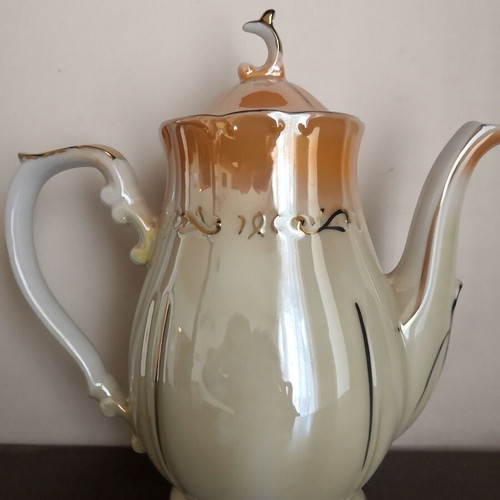 Porcelain teapot with opalescent surface and gold decoration