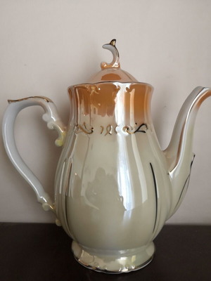 Porcelain teapot with opalescent surface and gold decoration