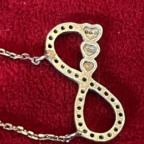 Silver 925 necklace with gold vermeil coating, infinity design with gold hearts, used