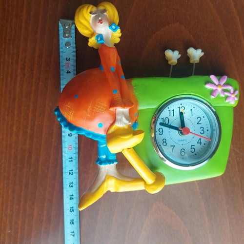 Table clock with female figure used, analog